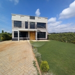 Modern flat roof house in a gated community