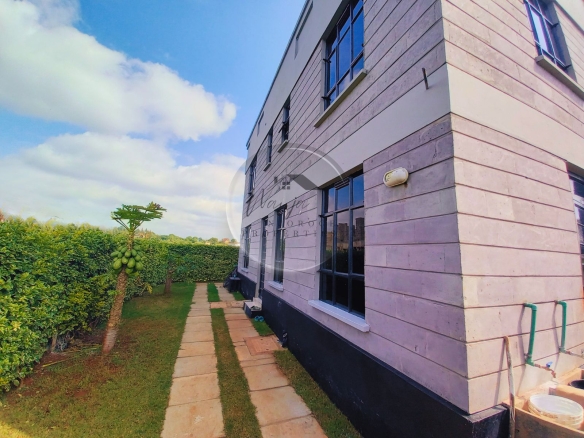 Modern flat roof house in a gated community